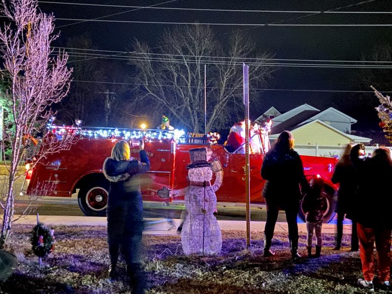 Santa and Mrs. Claus arrive in style thanks to Rehoboth Beach Volunteer Fire Company.